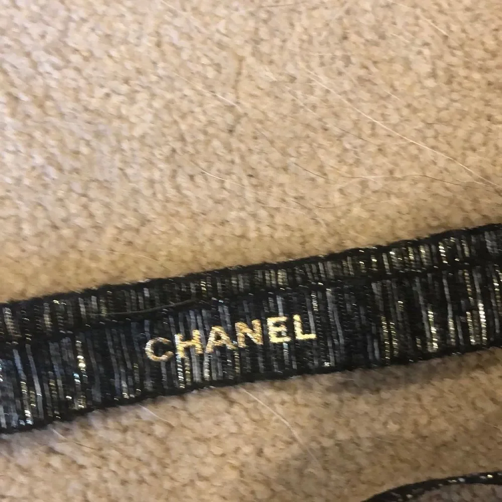 Chanel holiday ribbon it’s black and white